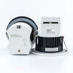 Two fire-rated LED downlights shown disassembled, displaying white trim ring with specifications and black cylindrical body w
