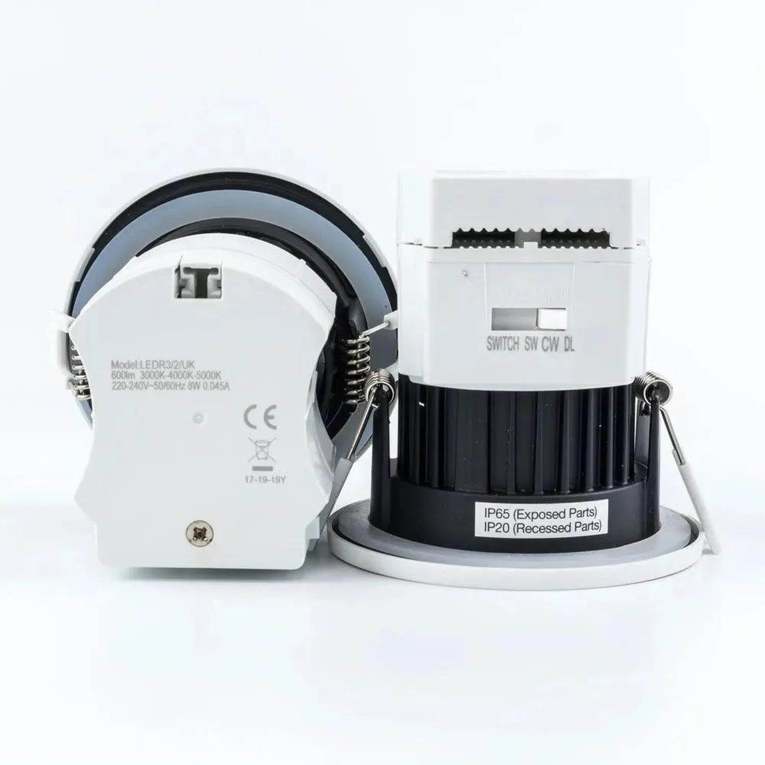Two fire-rated LED downlights shown disassembled, displaying white trim ring with specifications and black cylindrical body w