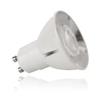 White LED GU10 spotlight with reflector and metal contacts, shown at an angle against white background with reflection.