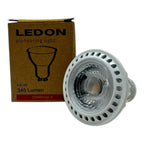 Ledon 6W LED GU10 bulb with packaging. White ribbed reflector bulb next to brown box labeled "pioneering light," 345 Lumen, D