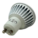 White LED GU10 bulb with ribbed reflector and brass pins, displayed against white background.