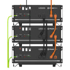 Three stacked Pylontech US5000 battery units with orange and black cables connected, green power cords on left side, control 
