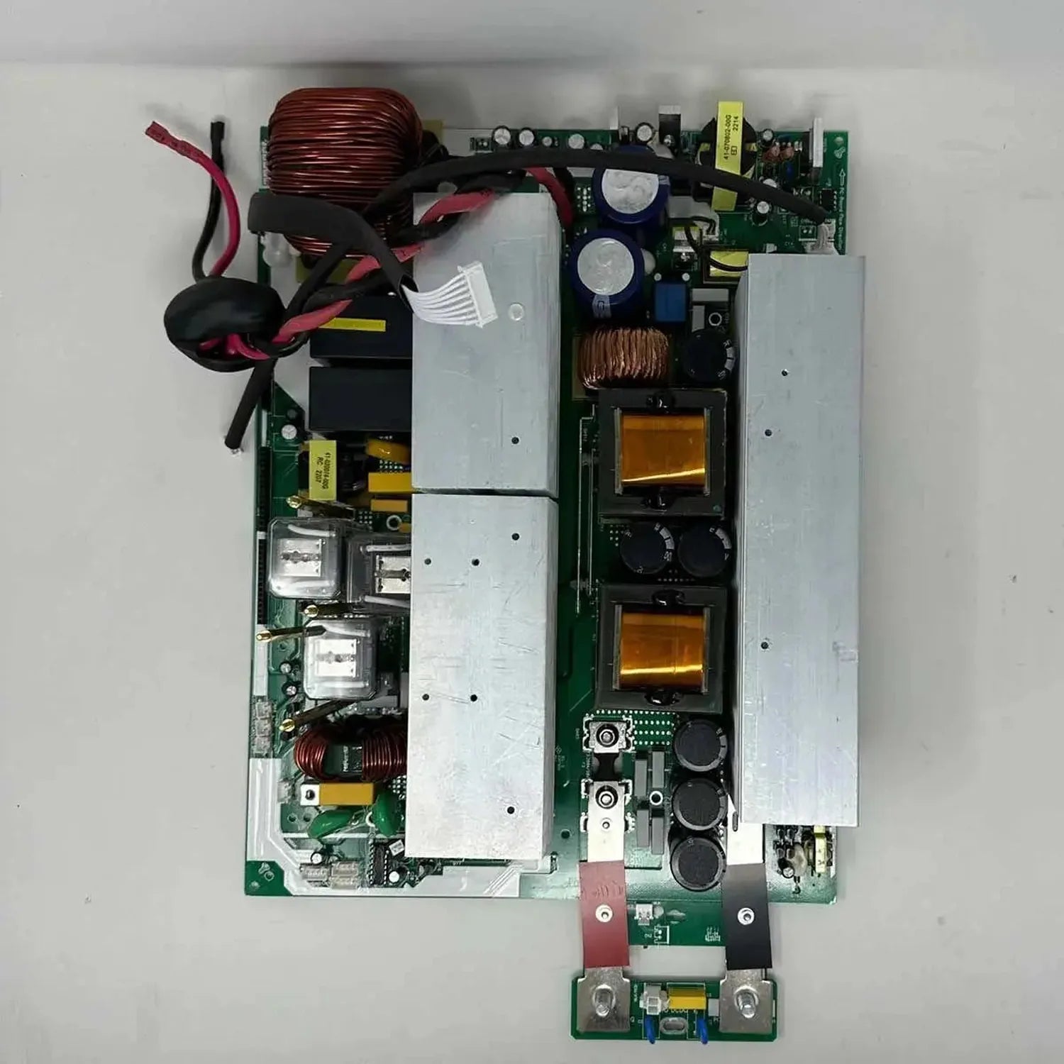 Main inverter board PCB assembly with transformer coils, capacitors, and circuit components for solar inverter power supply.