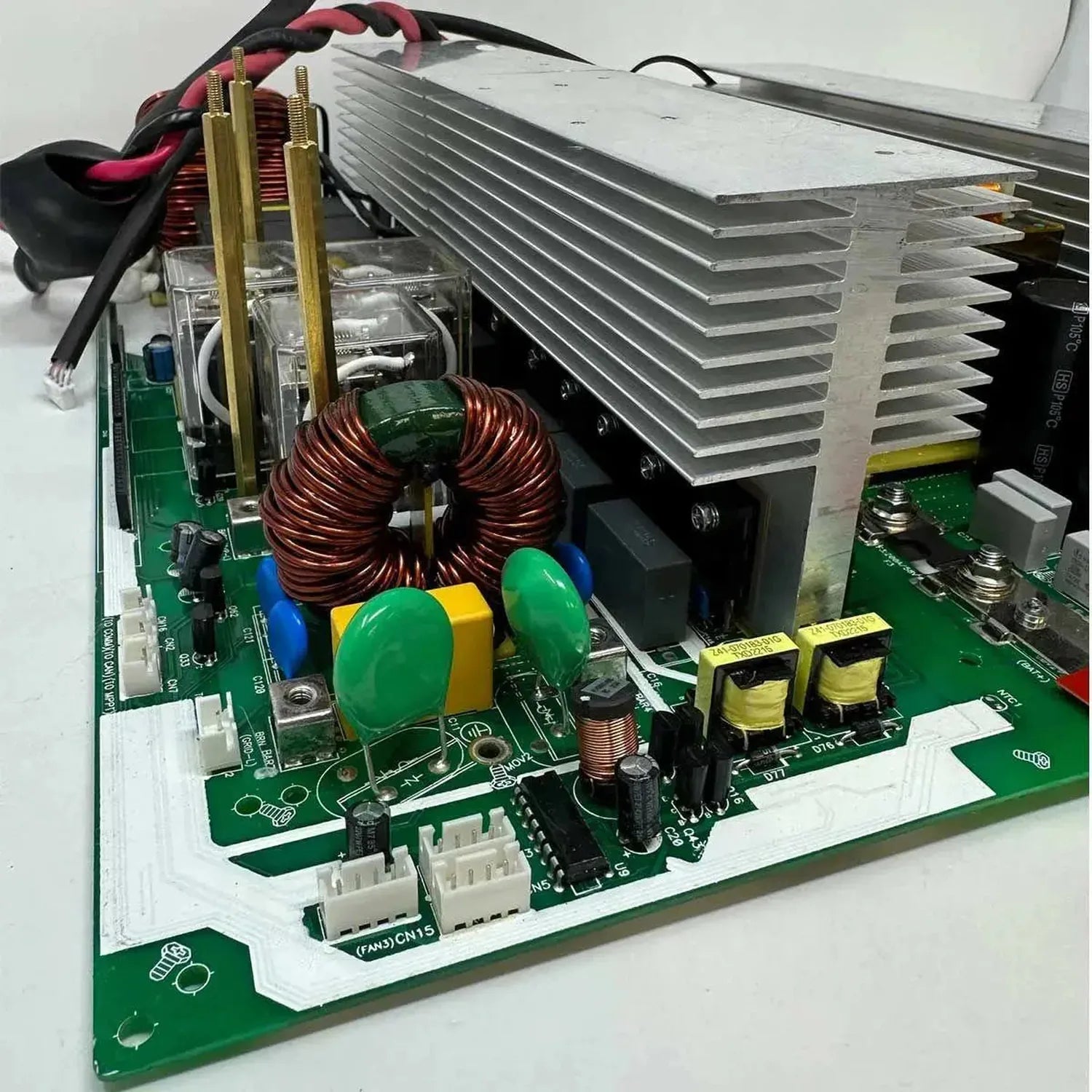 Internal view of 8kW MAX-II inverter main board showing green circuit board, copper inductor coil, aluminum heatsink fins, an