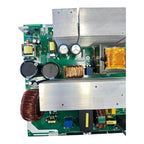 Replacement main inverter board with green circuit cards, aluminum heat sinks, electrolytic capacitors, transformers, and cop