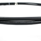 Black rubber hose labeled Helukabel with 1x50 QMM specifications and voltage rating, close-up detail shot.