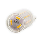 Close-up of G9 LED bulb showing frosted glass housing, yellow COB chips, and AC 230V marking on base.