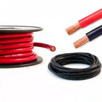 Red and black PVC battery cables coiled and displayed with exposed copper wire ends and a spool showing cable construction de