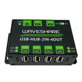 Waveshare USB-HUB-2IN-4OUT hub showing top view with four USB ports, power indicator, and green control switches for dual inp