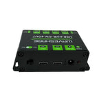 Black rectangular USB hub with green buttons and two USB-C ports visible on front panel, top view product shot.