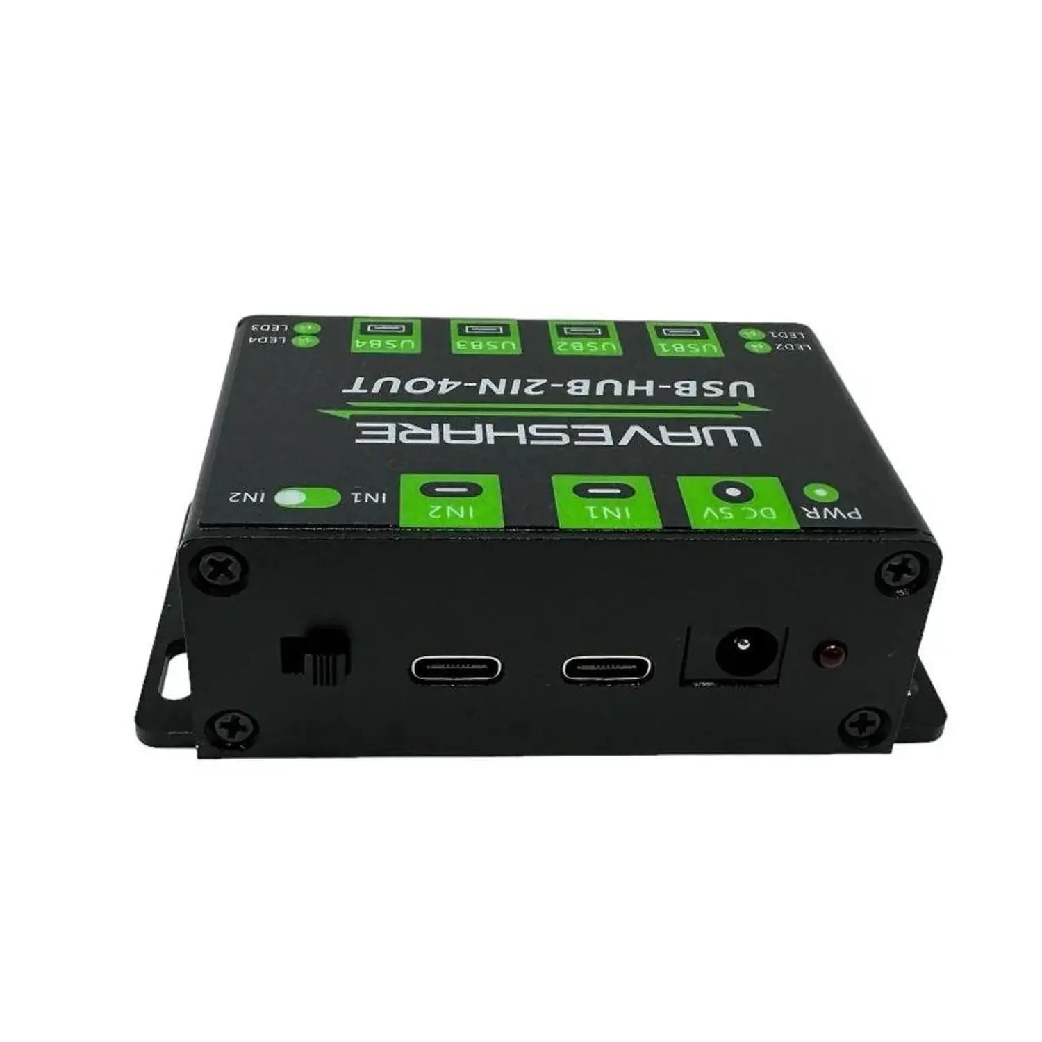 Black rectangular USB hub with green buttons and two USB-C ports visible on front panel, top view product shot.