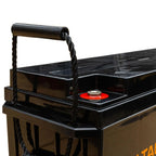 Black solar power kit with rope handle, red battery indicator light visible on top panel, gold branding on lower side.