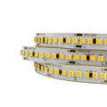 Three coiled DC24V LED strips with warm white SMD2835 diodes and integrated resistors on white backing.