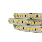 Three coiled DC24V LED strips with warm white SMD2835 diodes and integrated resistors on white backing.