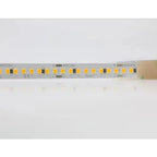 Close-up of warm white LED strip showing individual SMD2835 diodes on gray PCB with +DC24V markings and RoHS certification la