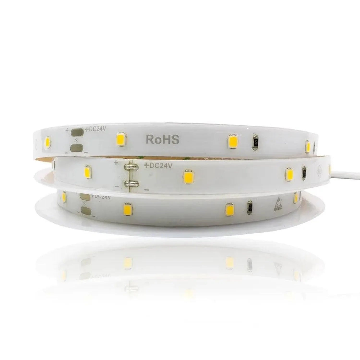 Coiled white LED strip light with yellow SMD components, marked RoHS and +DC24V, displayed against white background.