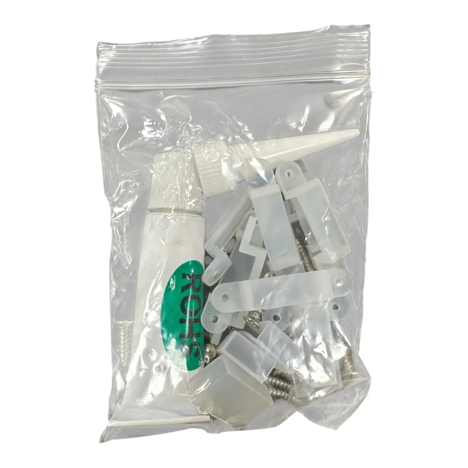 LED strip light components in clear resealable bag, including white connectors, green circuit board, and coiled cable.