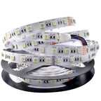 WRGB LED strip light coiled on black spool with control wires and connector modules visible