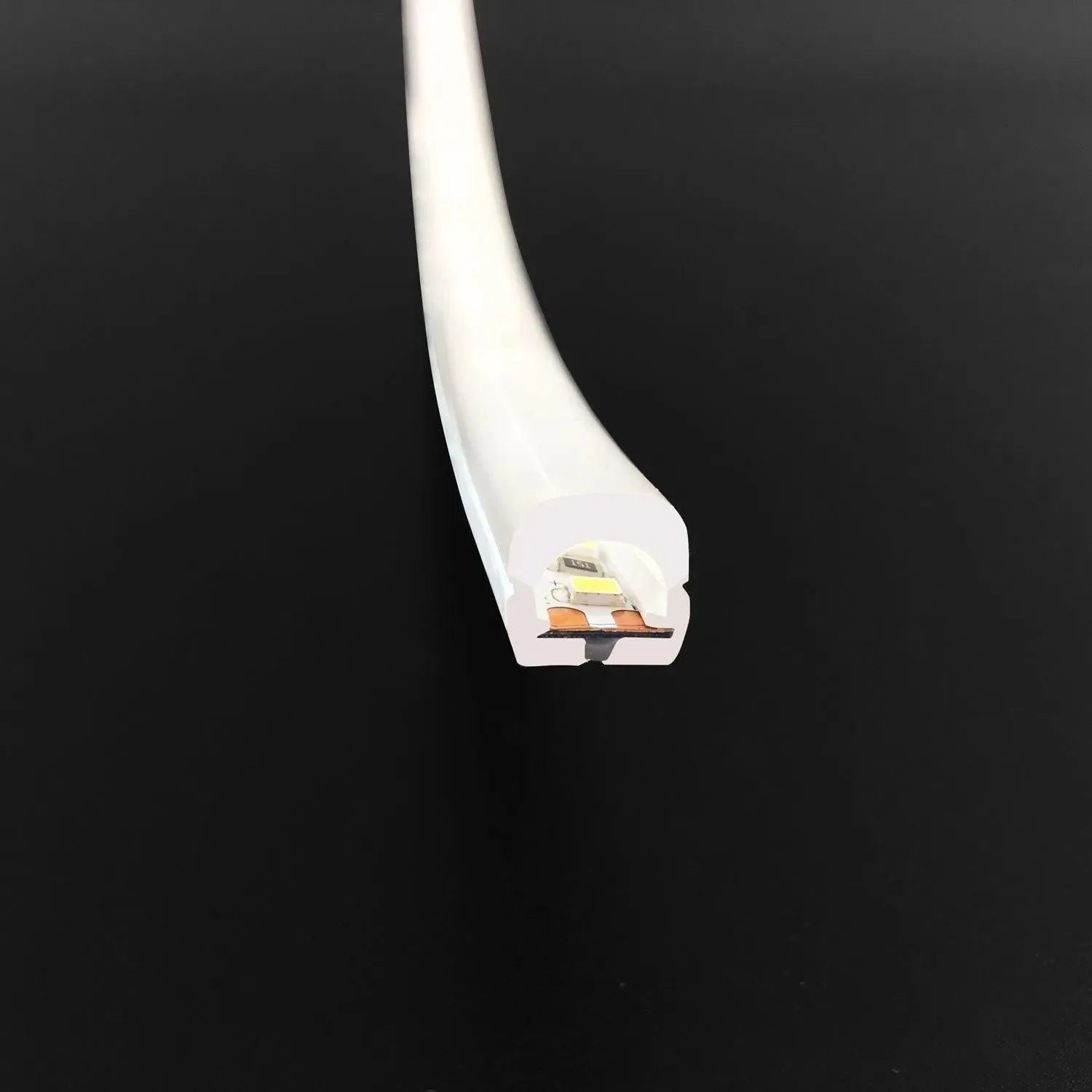 White flexible LED neon strip light shown end-on against black background, revealing internal circuitry and copper contacts.