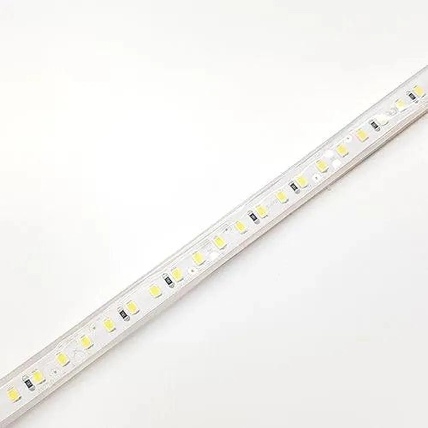 LED strip light with warm white SMD LEDs mounted on white PCB, shown at an angle against white background.