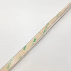 Coiled LED strip light with green text labeling on tan packaging, showing 300 LEDs specification and 5m length marking.