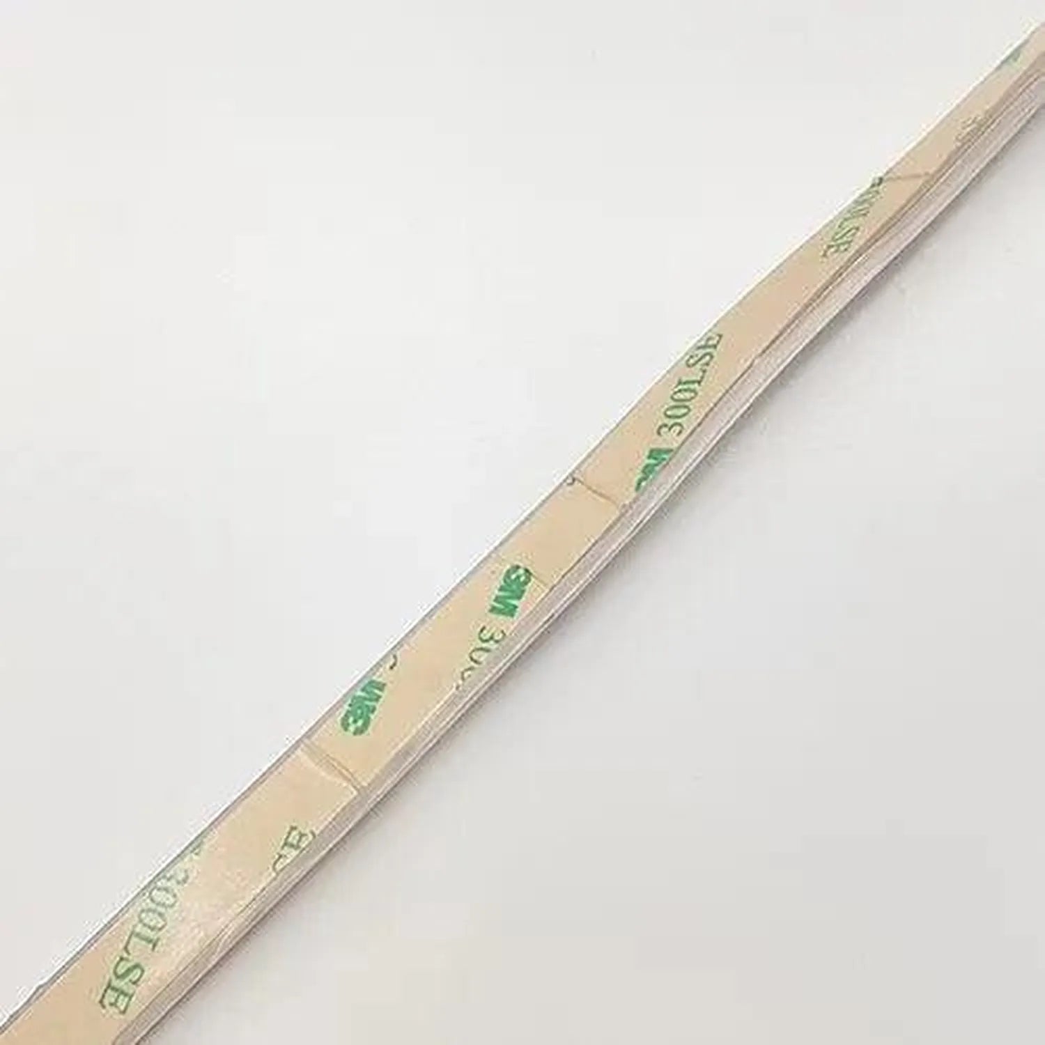 Coiled LED strip light with green text labeling on tan packaging, showing 300 LEDs specification and 5m length marking.