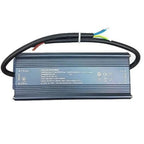 Voltacon Power LED driver with aluminum housing, input/output wiring, and specification label visible.