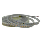Coiled LED strip light with warm white LEDs on flexible silicone tubing, showing exposed wire connectors at end.