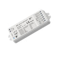 White rectangular WiFi LED strip controller with terminal connectors, control buttons, and technical specification label visi