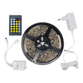 Smart WiFi LED strip light kit with remote controller, power adapter, and wireless receiver module displayed flat lay.