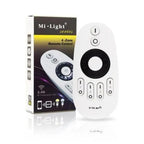 Mi-Light 4-Zone Remote Control with packaging box displayed side by side, white oval remote with black circular dial and butt