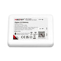 MiBoxer Zigbee 3.0 Gateway device label showing model ZB-Box1 specifications, certifications, and QR code for app installatio