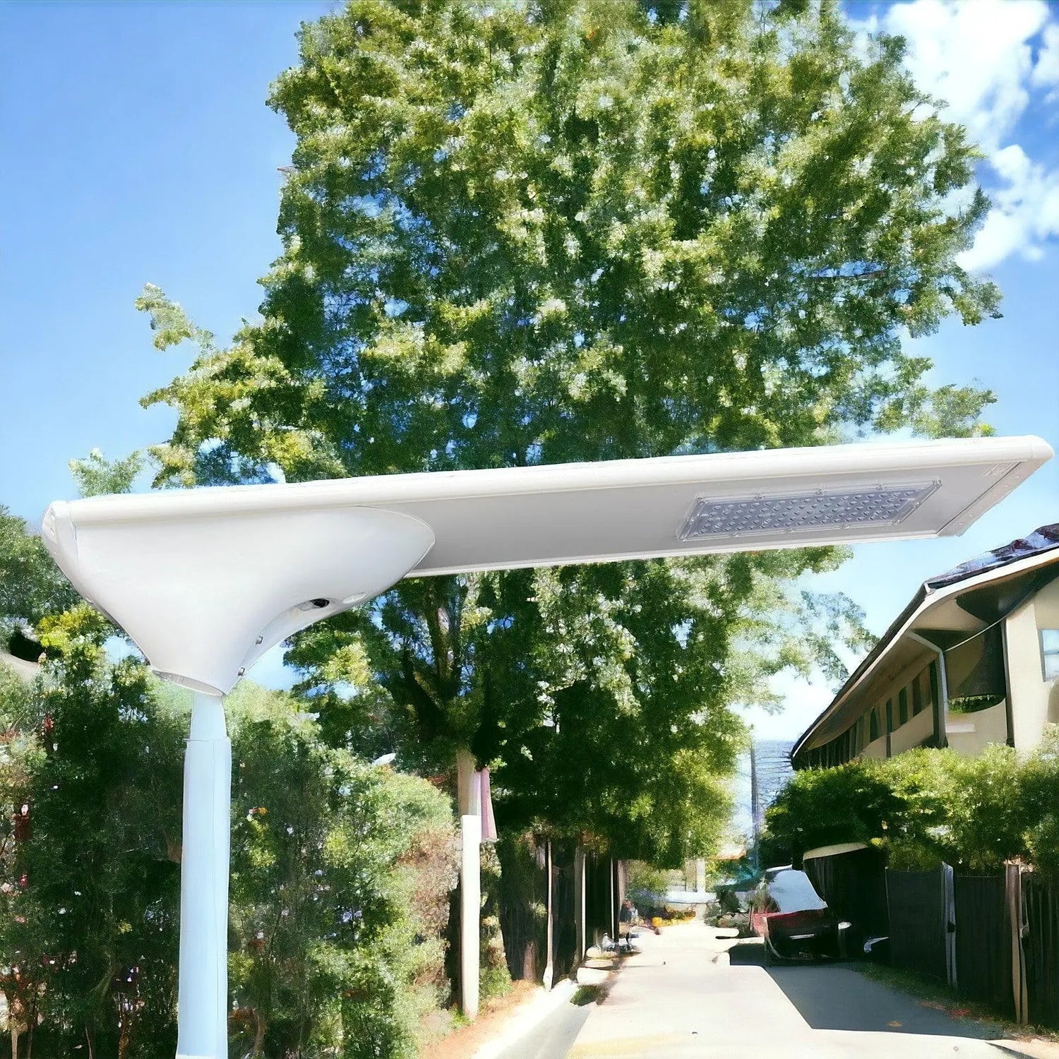 White solar street light mounted on pole in residential alley, with integrated LED panel and motion sensor visible on horizon