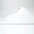 White solar LED street light mounted on pole, side view showing curved reflector design and mounting hardware.