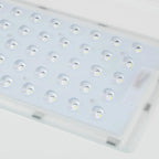 White rectangular LED panel with grid of recessed light fixtures and yellow LED cores, angled product shot.