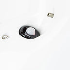 Black solar motion sensor light with white dome mounted in ceiling fixture, shown with mounting screw above.