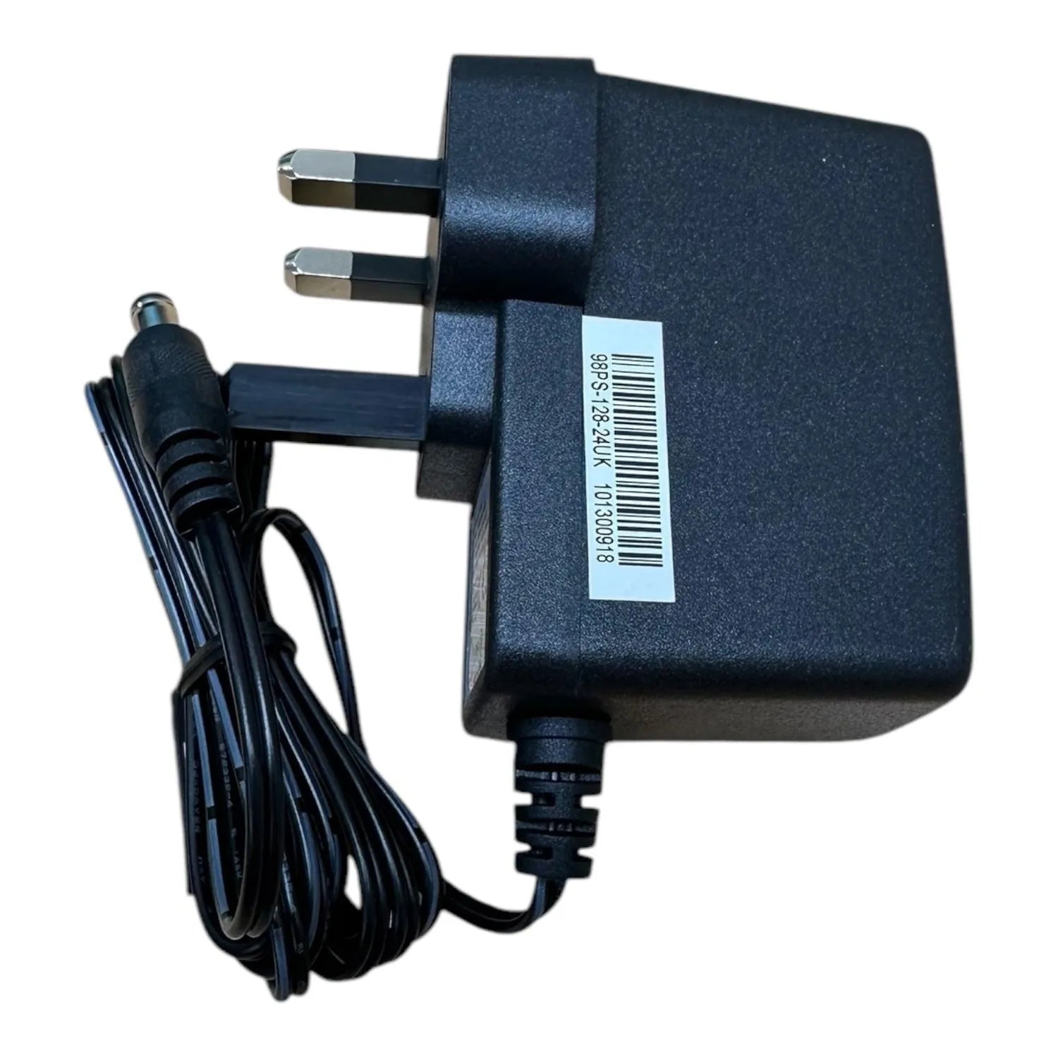 Black UK mains power adapter with folding prongs, DC barrel connector, and barcode label visible on body.