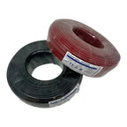 Two coiled spools of PV solar cable, one black and one red, with product labels visible, displayed against a white background