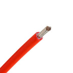 Red solar PV cable with exposed copper strands at one end, showing double insulation and approximately 10mm² cross-section.