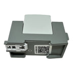 Top-down view of gray PV surge protection device with white connector ports and QR code label on underside.
