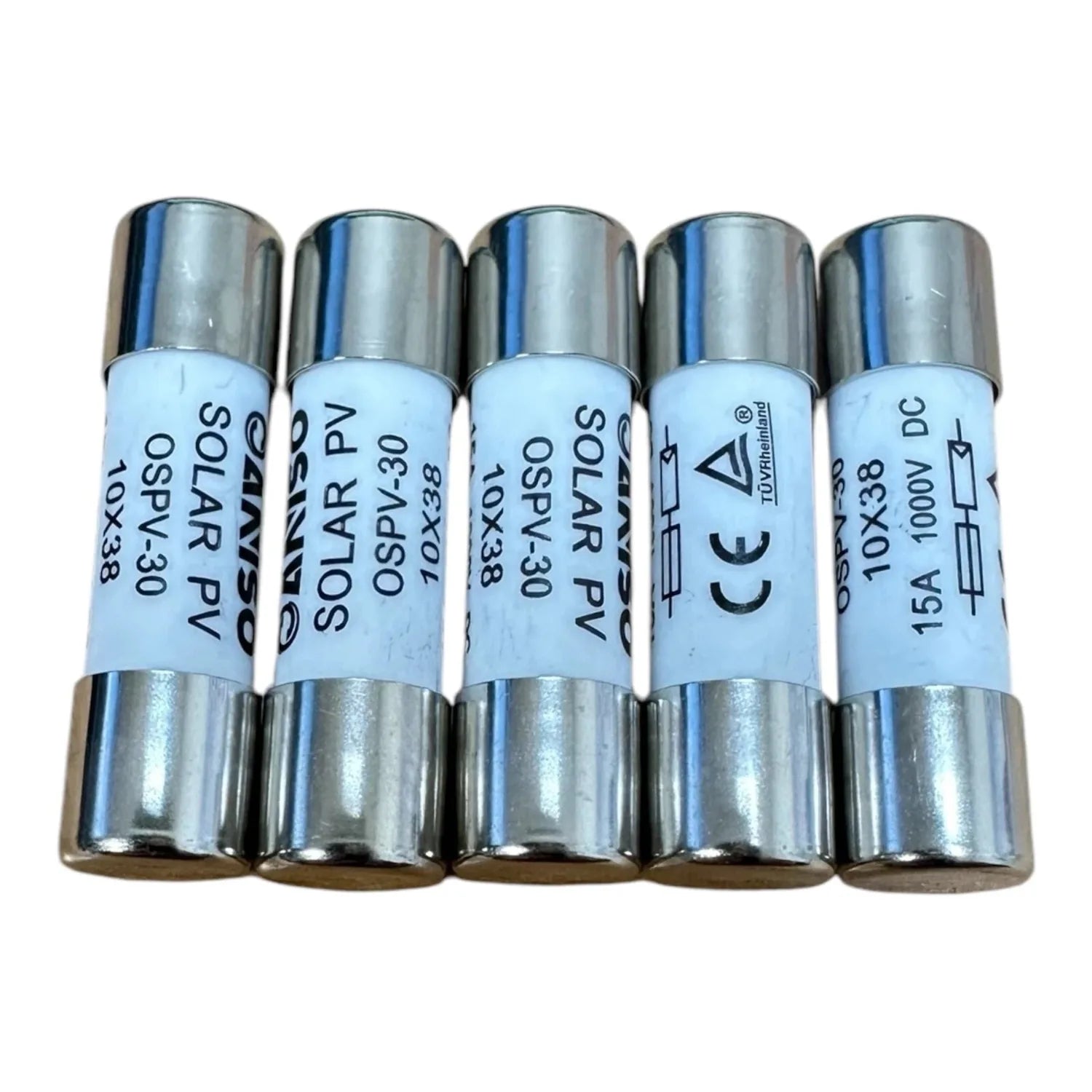 Five cylindrical solar PV string fuses with metal end caps and light blue labels showing specifications including voltage and