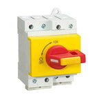 Yellow and red DC switch disconnector with ION and OFF markings, mounted on white DIN rail housing with terminal connections.