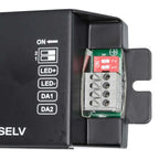 Interior view of DALI LED driver showing control panel with ON switch, LED+/LED- buttons, DA1/DA2 inputs, and red DIP switch 