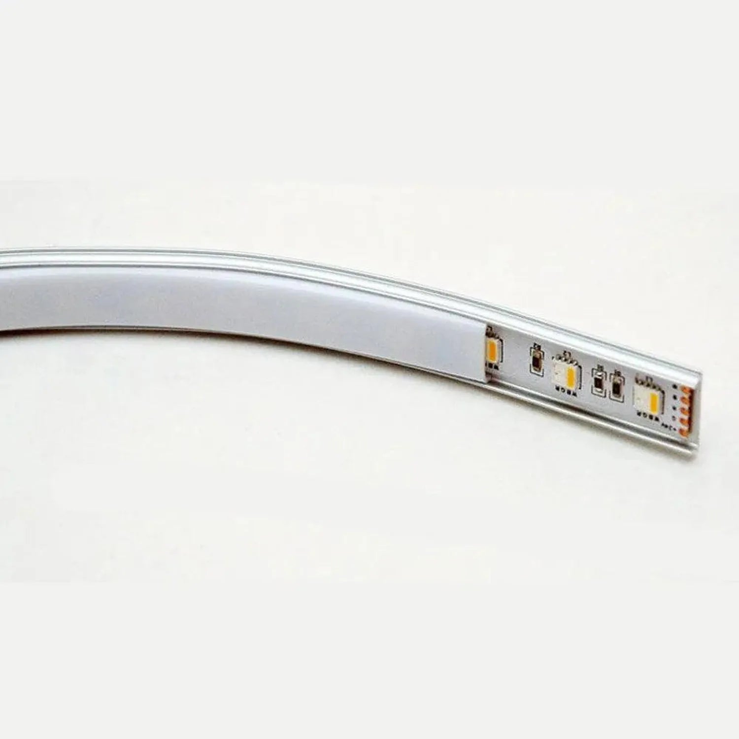 Curved aluminum LED profile strip with integrated LED components and connector ports visible on the end section, shown agains