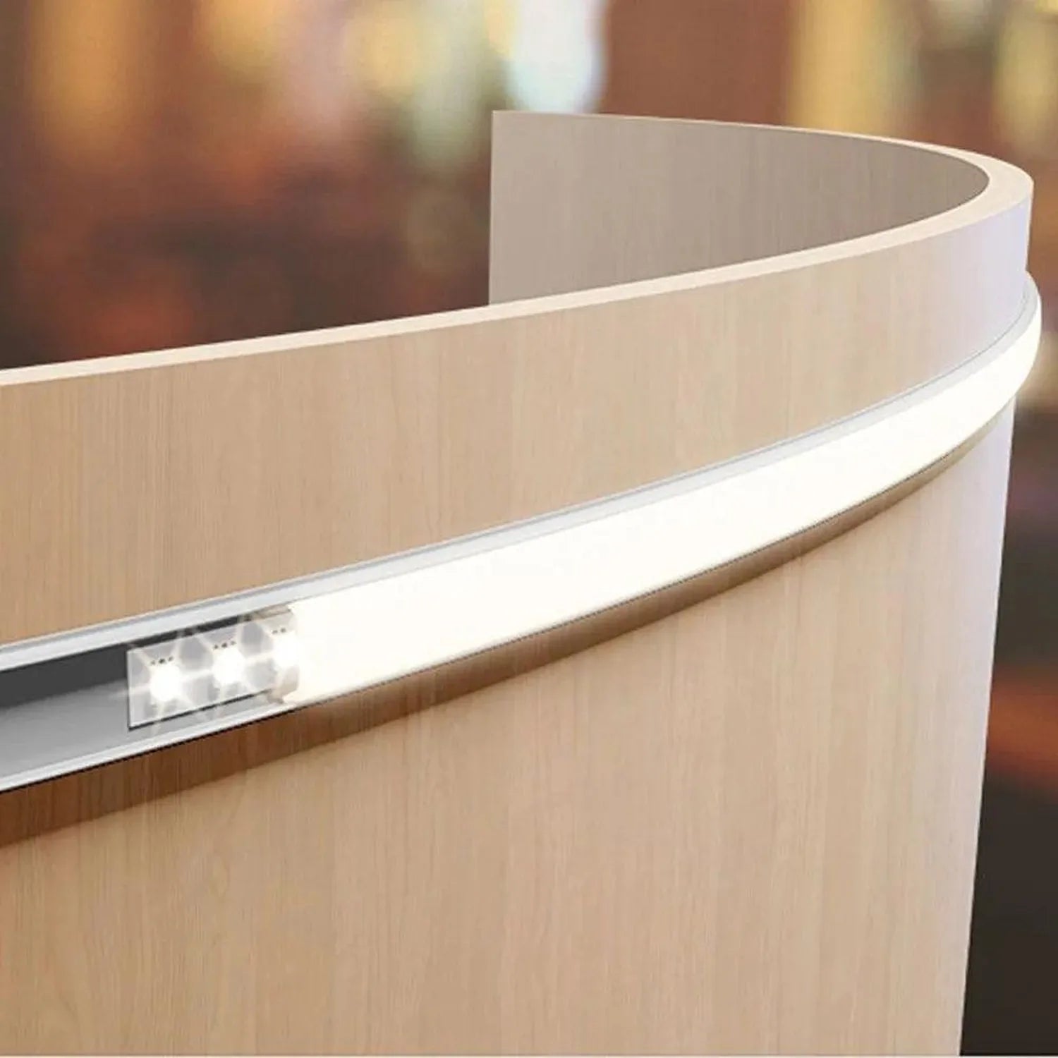 Curved aluminum LED profile with integrated white LED strip, showing flexible bend and polished metal trim detail.