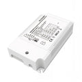 White rectangular LED driver with finned heat sink and control circuit board displaying technical specifications and DMX comp