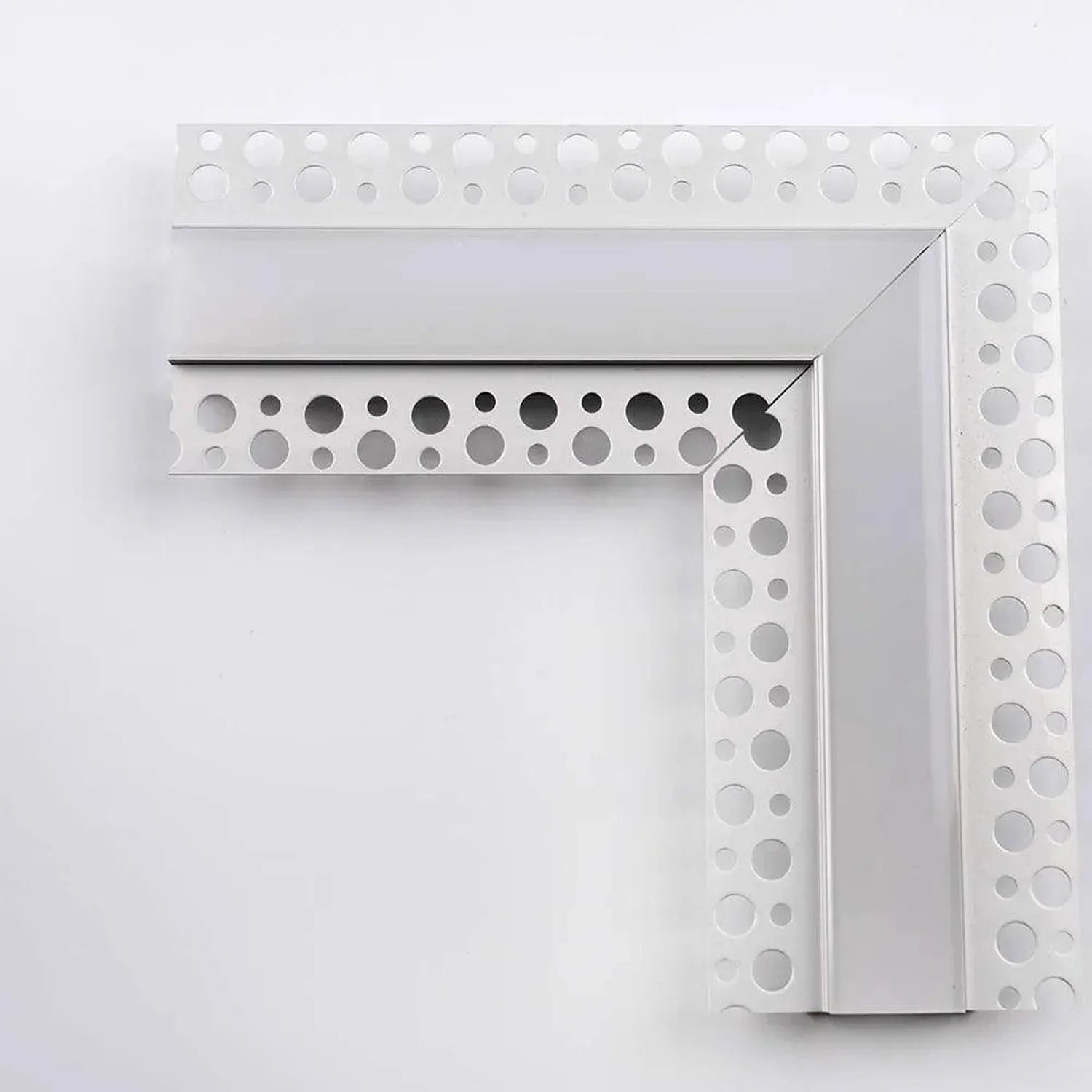 White metal corner trim with circular perforations and integrated LED profile channel for drywall installation.