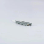 Recessed aluminum U-channel profile for LED strips, angled view showing grooved interior and flat mounting surface against wh