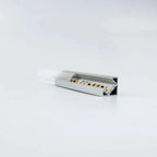 Open aluminum LED profile corner unit showing internal wiring and connector terminals against white background.