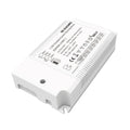 White rectangular LED driver with finned heatsink, technical specifications and CE marking visible on top label.